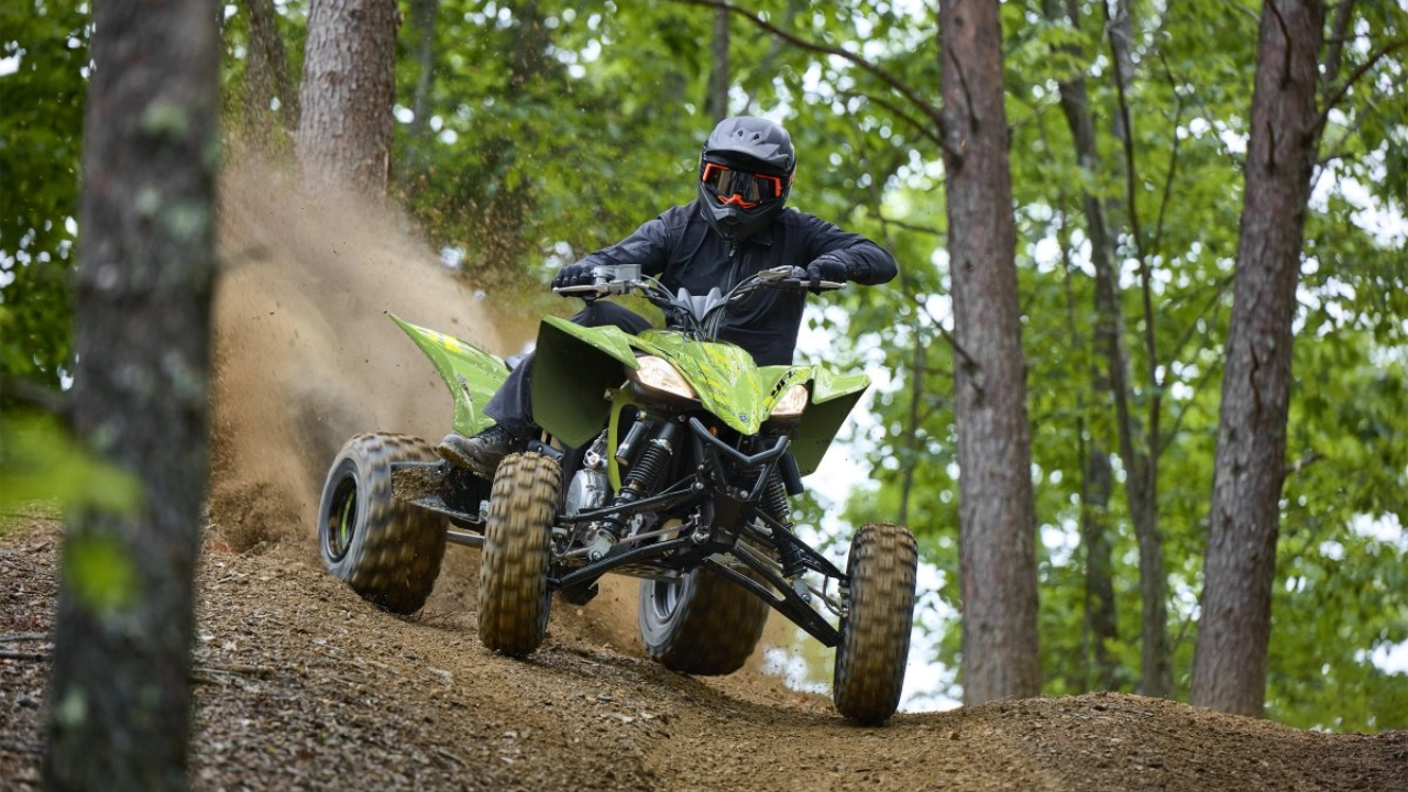 2026 Yamaha YFZ45r SE Racing through wooded trail.