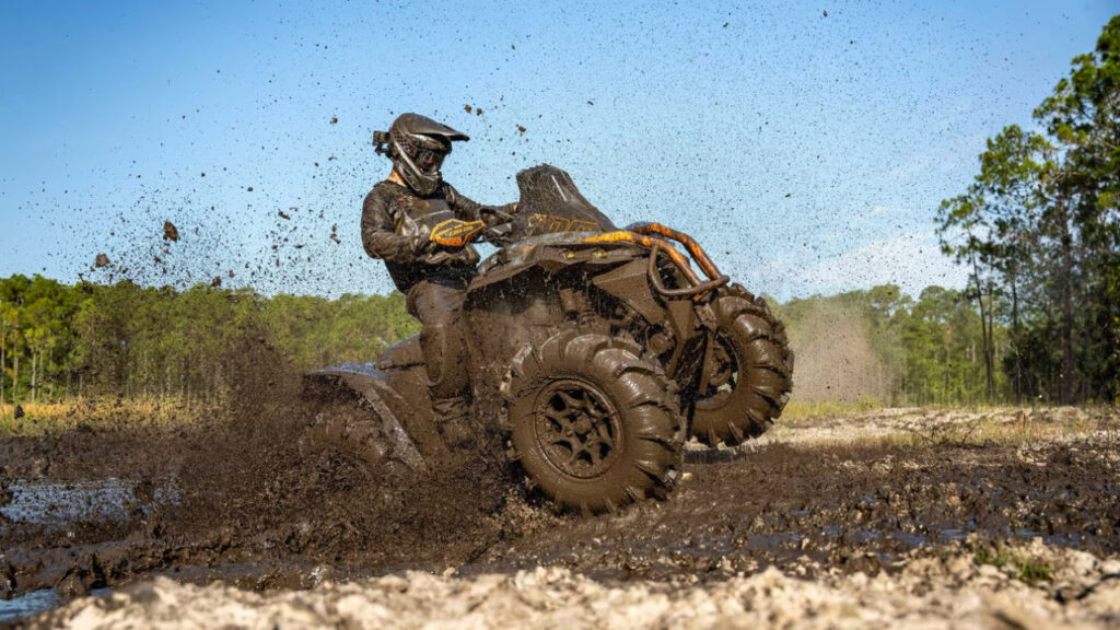 Can-Am Renegade 650 Sport ATV driving through muddy water