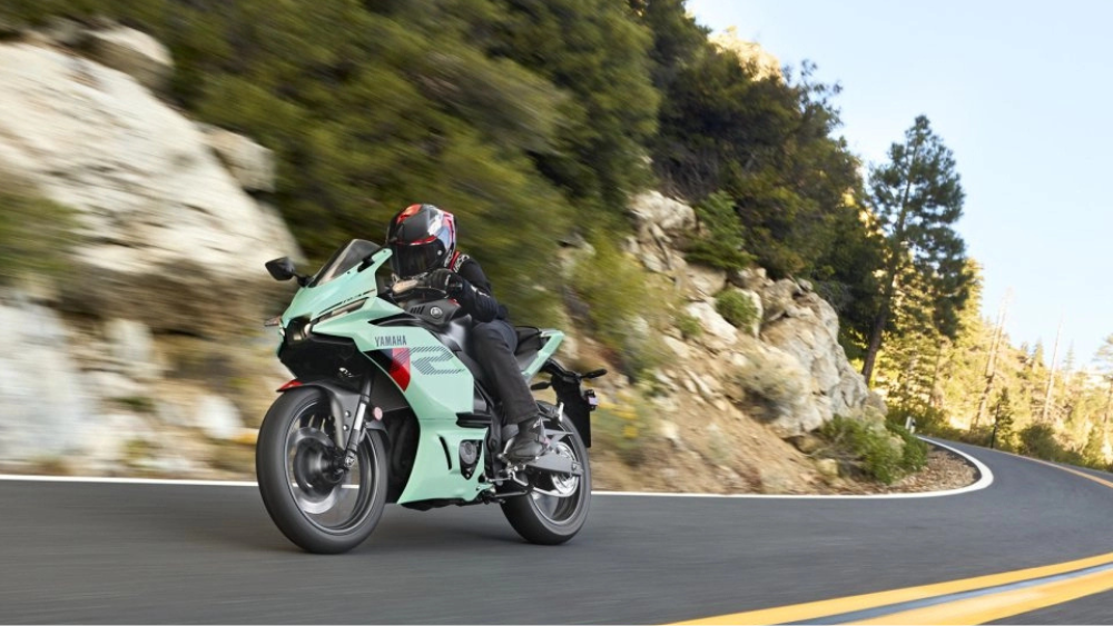 A rider taking a curve on a Yamaha YFZ-R3 in Miami Mint Green.