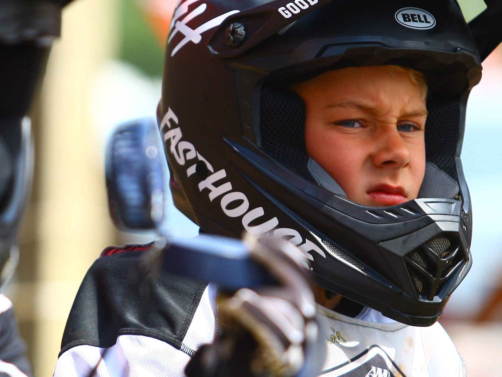 Close up of youth wearing off-road helmet