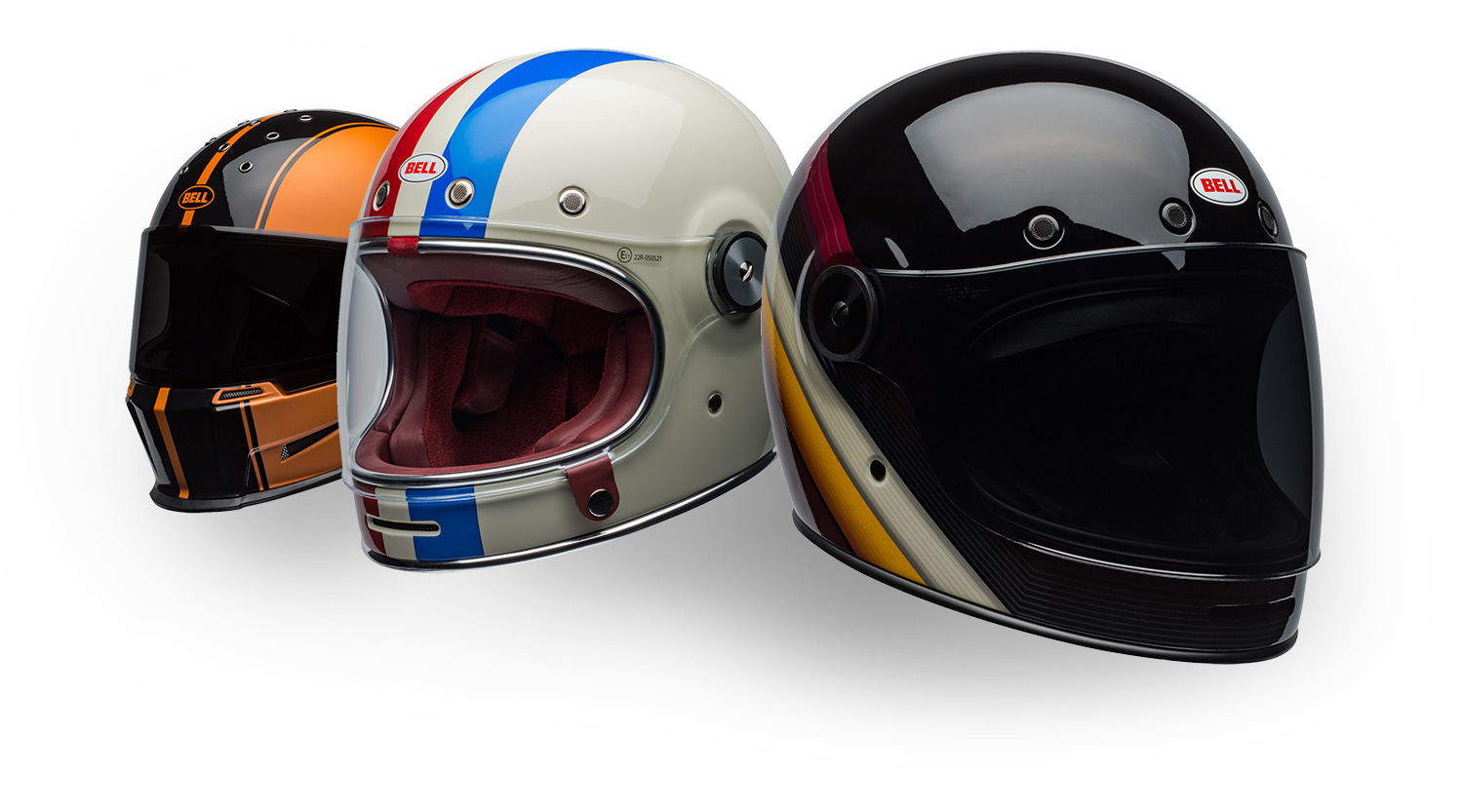 trio of striped Bell helmets facing away at angle with front one facing opposite of back two