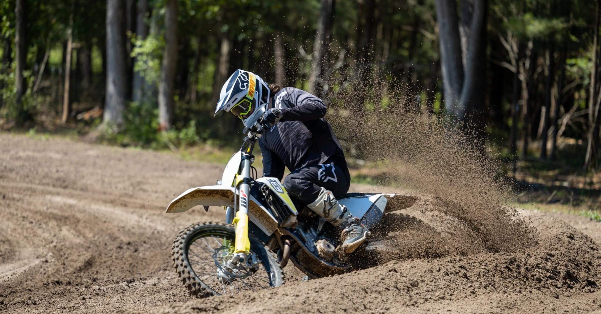 dirt bike rider taking a turn at cowbranch mx via facebook page