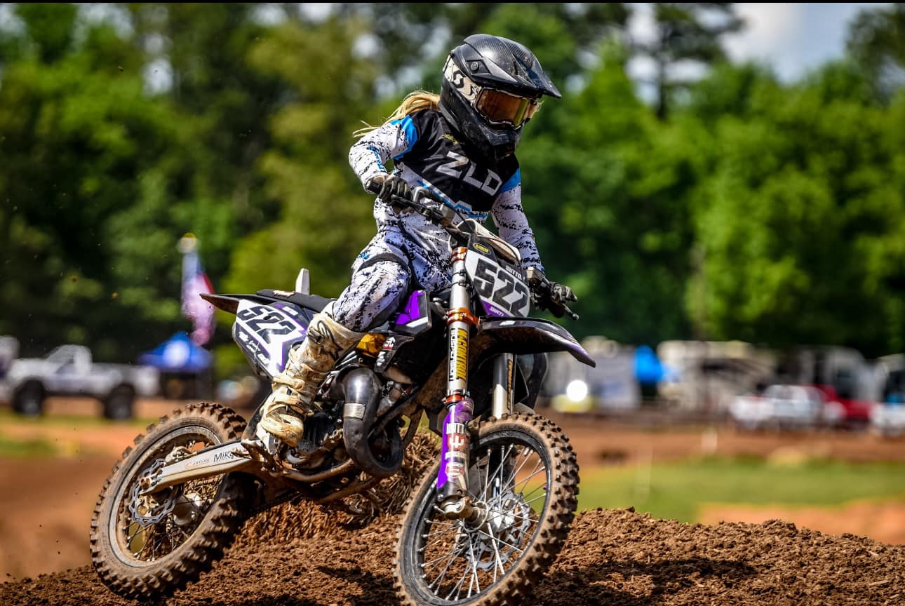 femail dirt bike rider traversing a track at North Carolina Motorsports park via facebook page